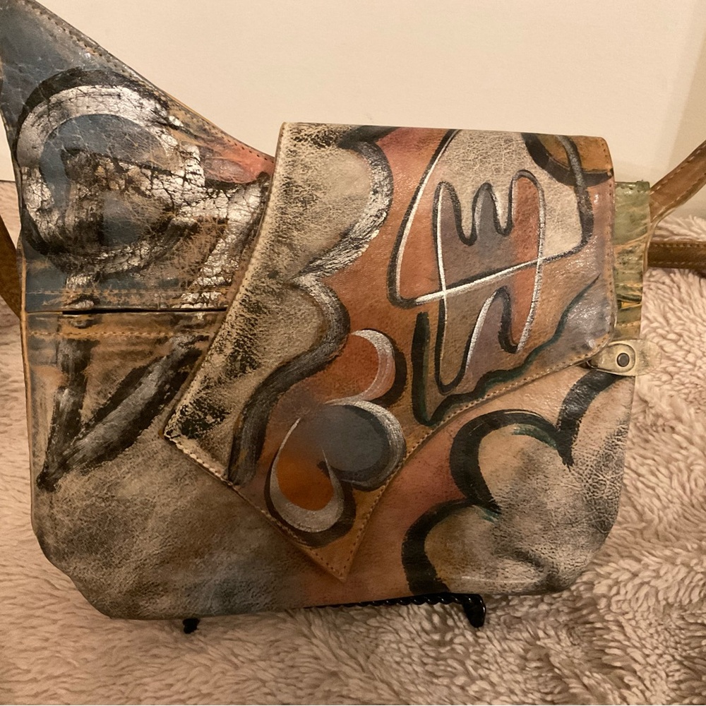 Multicolored unique bag by Botary. Lots of zippers and pockets. Like new!